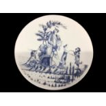 Pottery charger of humorous design depicting minstrel with dancing bear and animals, signed with ini