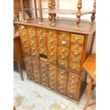 Early 20th century oak bank of drawers with brass handles (one drawer missing) 107cm wide, 50cm deep