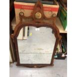 A wooden framed wall mirror with fret cut mount, 90 cm high x 48 cm wide