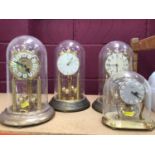 Collection of twelve anniversary clocks with perpetual motion movements including some with glass do