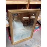 Bevelled wall mirror in gilt frame