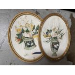 Pair of 19th century Chinese paintings on rice paper depicting vases of flowers, oval glazed frames,