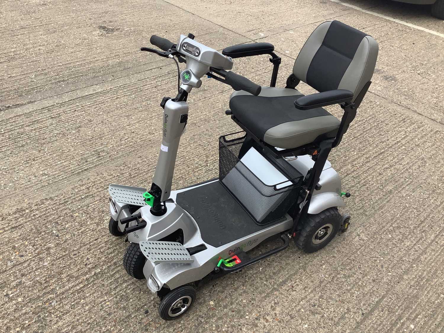 Quingo Flyte mobility scooter together with key and charger