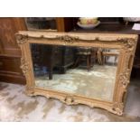 Good quality bevelled wall mirror in ornate gilt frame