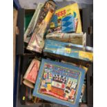 Group of vintage toys to include one box of mixed games, one box of model kits, one box of assembled