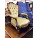 Victorian button back armchair with padded arm and seat on cabriole front legs