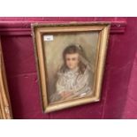 Victorian pastel portrait of a young girl in a gilt frame.