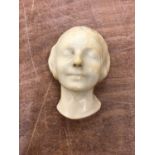 Simulated alabaster wall mask of young girl