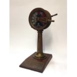 Brass ships telegraph mounted on wooden base with presentation plaque