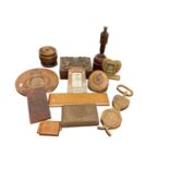 Collection of carved military treen including carved wood cigarette boxes carved with military badge