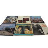 Three vintage brown cases of LP records including John Lee Hooker, The Rolling Stones, Moody Blues,