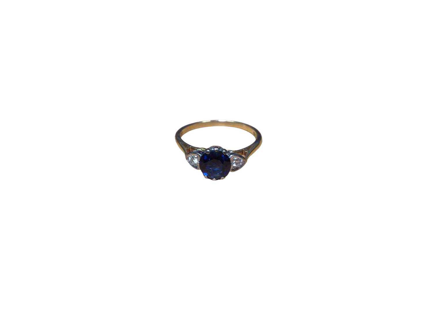 Sapphire and diamond three stone ring with heart shape diamond shoulders on 18ct gold shank