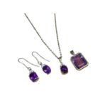 18ct gold amethyst and diamond pendant on 9ct gold chain, pair of matching earrings and an amethyst