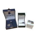 Silver golf tee and ball marker in fitted presentation box, silver napkin clip and a pair of silver