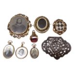 Victorian brooch with rotating glazed panel containing a portrait photograph and hairwork design to