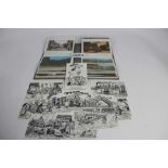 Postcards in four album including real photographic cards, firing cartridge factory