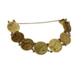 G.B. - A gold bracelet containing seven Half Sovereigns (N.B. Total Wt. 33.5gms) (1 coin bracelet)