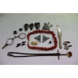 Objets vertu, including a coral necklace, mother of pearl knife, coin, etc