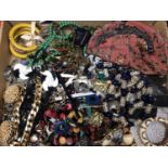 Group of vintage costume jewellery, a vintage evening bag with white metal mounts, a white metal flo