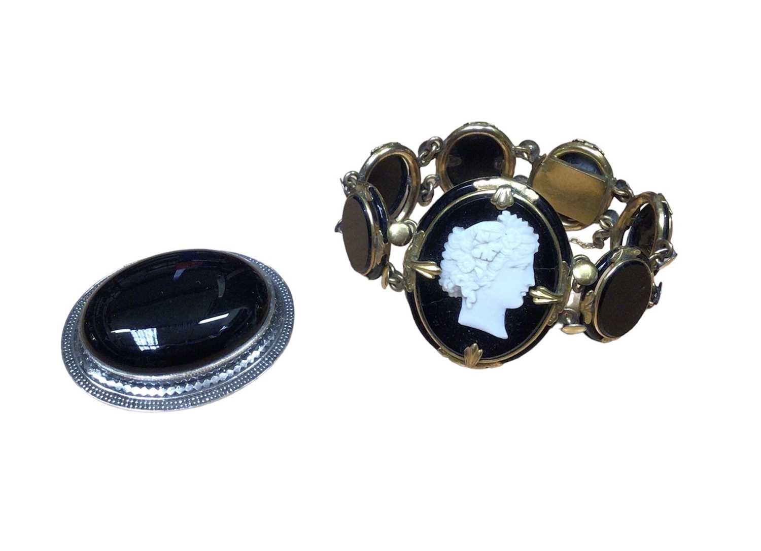 Victorian black glass cameo bracelet in yellow metal setting together with a black onyx and silver b