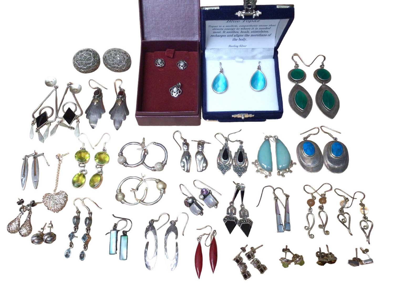 Collection of silver and white metal earrings, mostly gem set