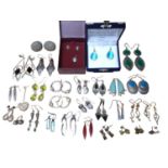 Collection of silver and white metal earrings, mostly gem set