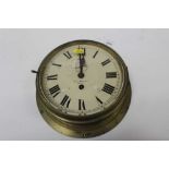 J.W. Benson, London, a brass bulkhead clock, white enamel dial, the case 27cm diameter