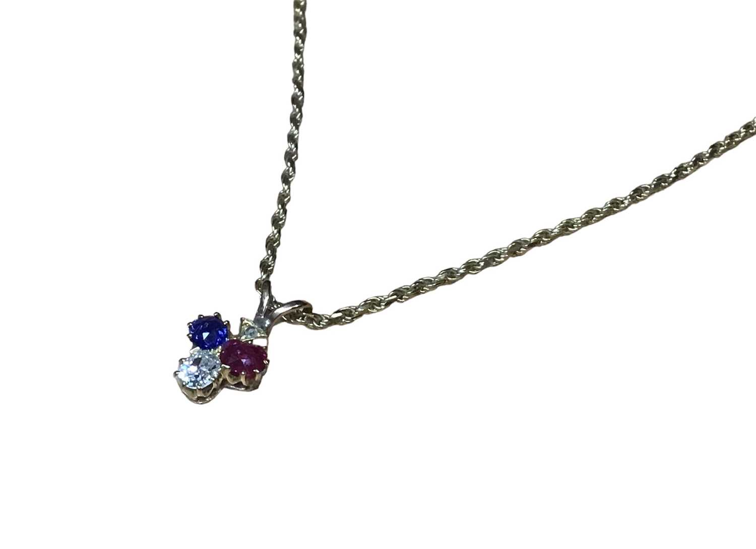 Victorian diamond ruby and blue sapphire pendant in the form of a spade, on a modern 9ct gold chain