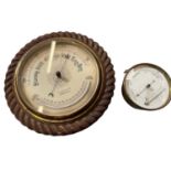 Early 20th century barometer with rope carved frame, together with a brass cased barometer. (2)