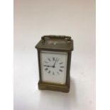 Brass cased carriage clock with enamel dial, 14cm high