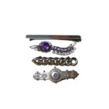 Two Edwardian 9ct gold bar brooches, 9ct gold brooch set with purple gem stones and a 9ct gold tie c