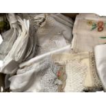 Large quantity of table linens including white damask cloths, wide crochet trimmed cloths, embroider