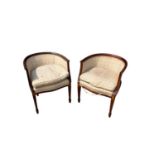 Pair of Edwardian mahogany and lined tub chairs