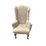 Wing armchair, on shell carved cabriole legs