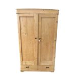 Pine wardrobe, with hanging space enclosed by two doors, drawer below, 115w x 53d x 201h