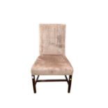 Antique upholstered chair on square legs joined by stretchers
