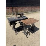 Antique Singer treadle sewing machine on black painted metal base