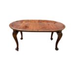 1920's mahogany oval extending dining table with extra leaf on cabriole legs, 149cm x 105cm