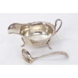 1930s silver sauce boat of conventional form with loop handle on four pad feet (Sheffield 1937) E.Vi