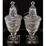 Pair of 19th century cut glass urns and covers