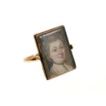 A rare George III double portrait ring with a double-sided revolving bezel containing two portrait m