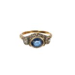 Antique French gold blue sapphire and diamond three stone ring in a pierced foliate setting