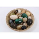 Collection of specimen polished eggs, including malachite, jasper, onyx, alabaster and others. In a