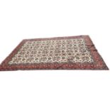 Good quality Heriz type rug with floral decoration on white, red and blue ground, 337cm x 250cm