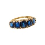 Antique sapphire five stone ring with five graduated oval mixed cut blue sapphires