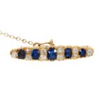 Victorian sapphire and diamond bar brooch with five oval mixed cut blue sapphires interspaced by old