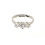Diamond three stone ring with three round brilliant cut diamonds in claw setting on 18ct white gold