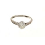 Diamond single stone ring with further diamonds to the shoulders