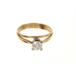 Diamond single stone ring in a four claw platinum setting on an 18ct yellow gold three band shank