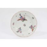 An 18th century Chelsea porcelain plate, polychrome painted with floral sprays, with iron-red painte